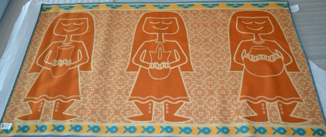 2017.11.01, orange Pendleton Blanket designed by Jody Naranjo with three women holding pottery