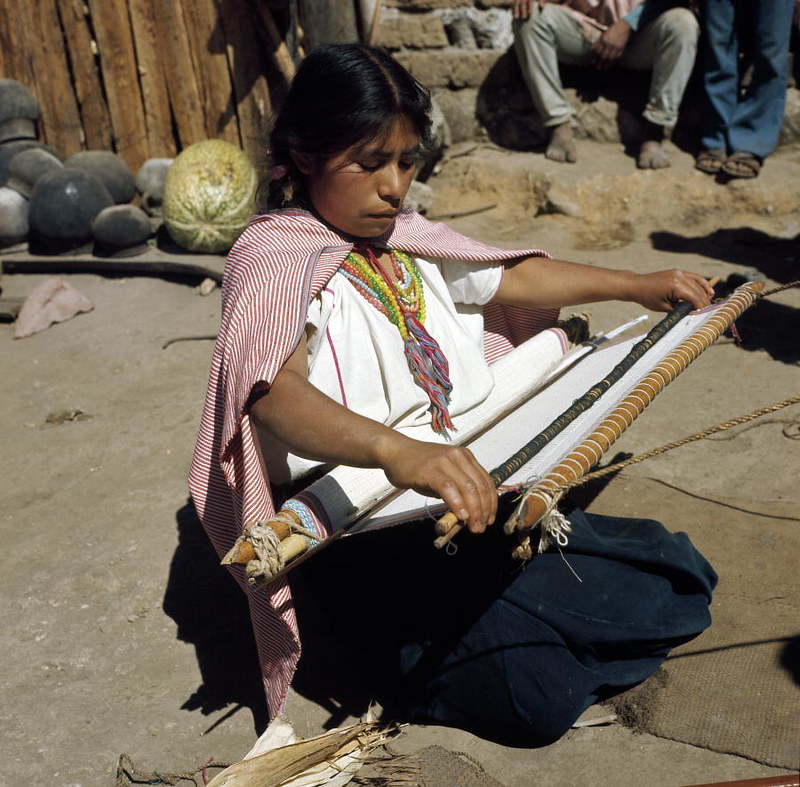 President of the youth club in the village of Navenchauc weaving a cloth.