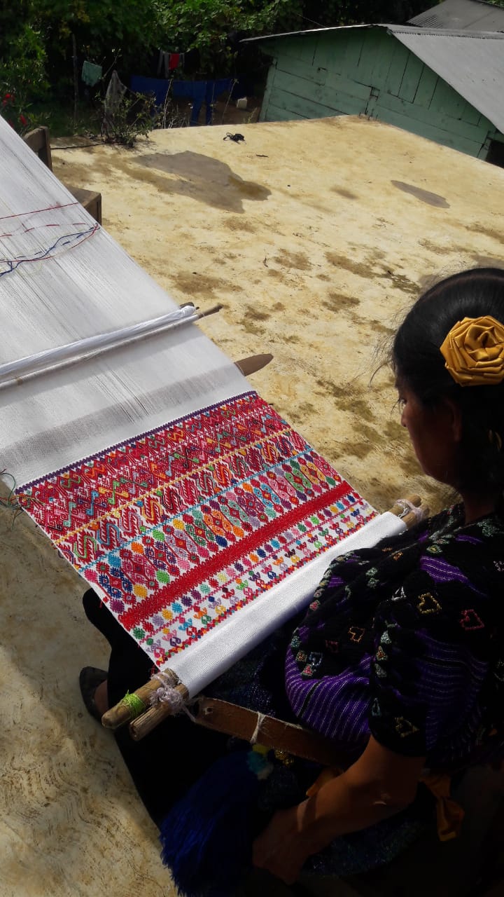 Progress of weaving the saint's huipil